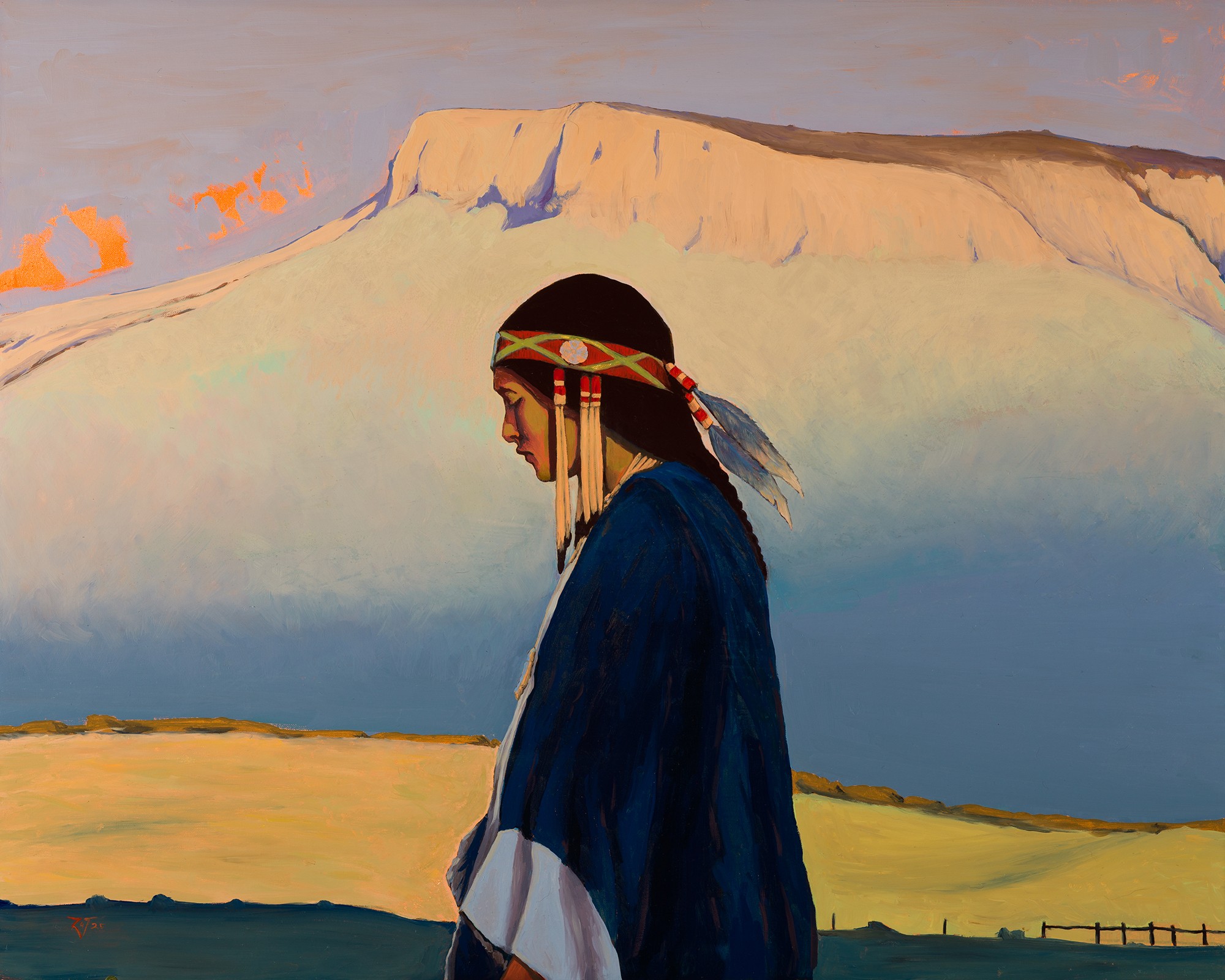 Person in traditional clothing with headband, standing outdoors with mountain and sky background.