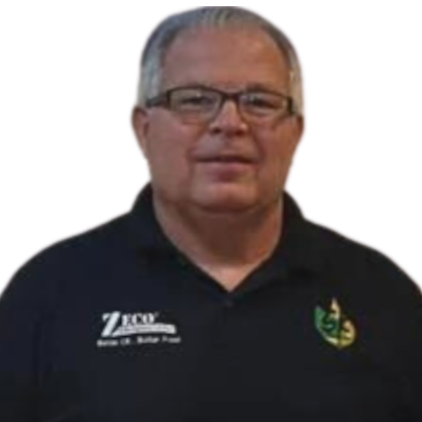 Man with glasses and gray hair wearing a black polo shirt with logos, against a black background.