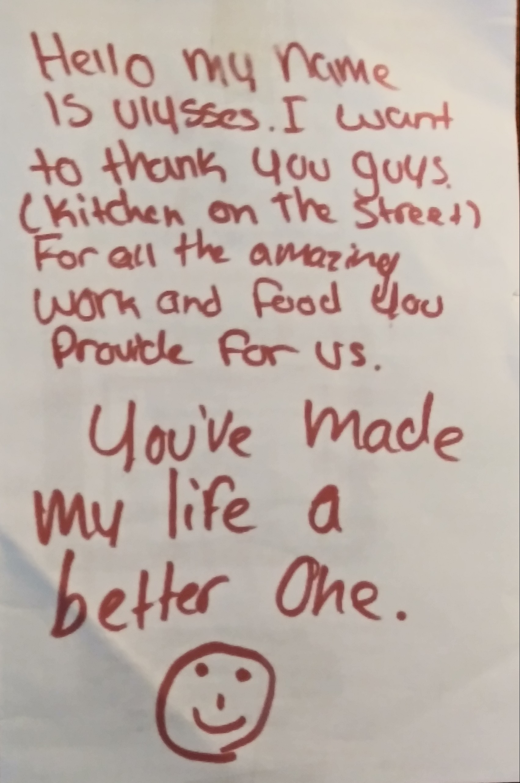 Handwritten note thanking kitchen staff, with a smiley face drawing, expressing gratitude for their work and impact.