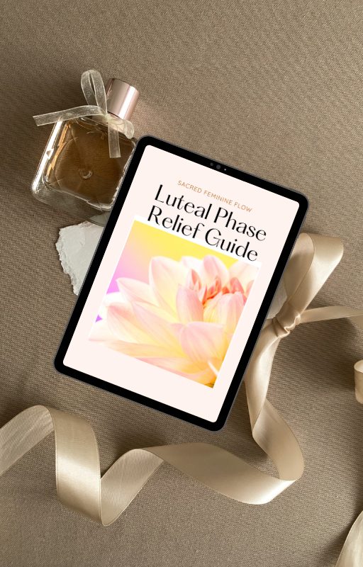 Tablet displaying 'Luteal Phase Relief Guide' with a pink flower, placed on a beige surface with decorative items.