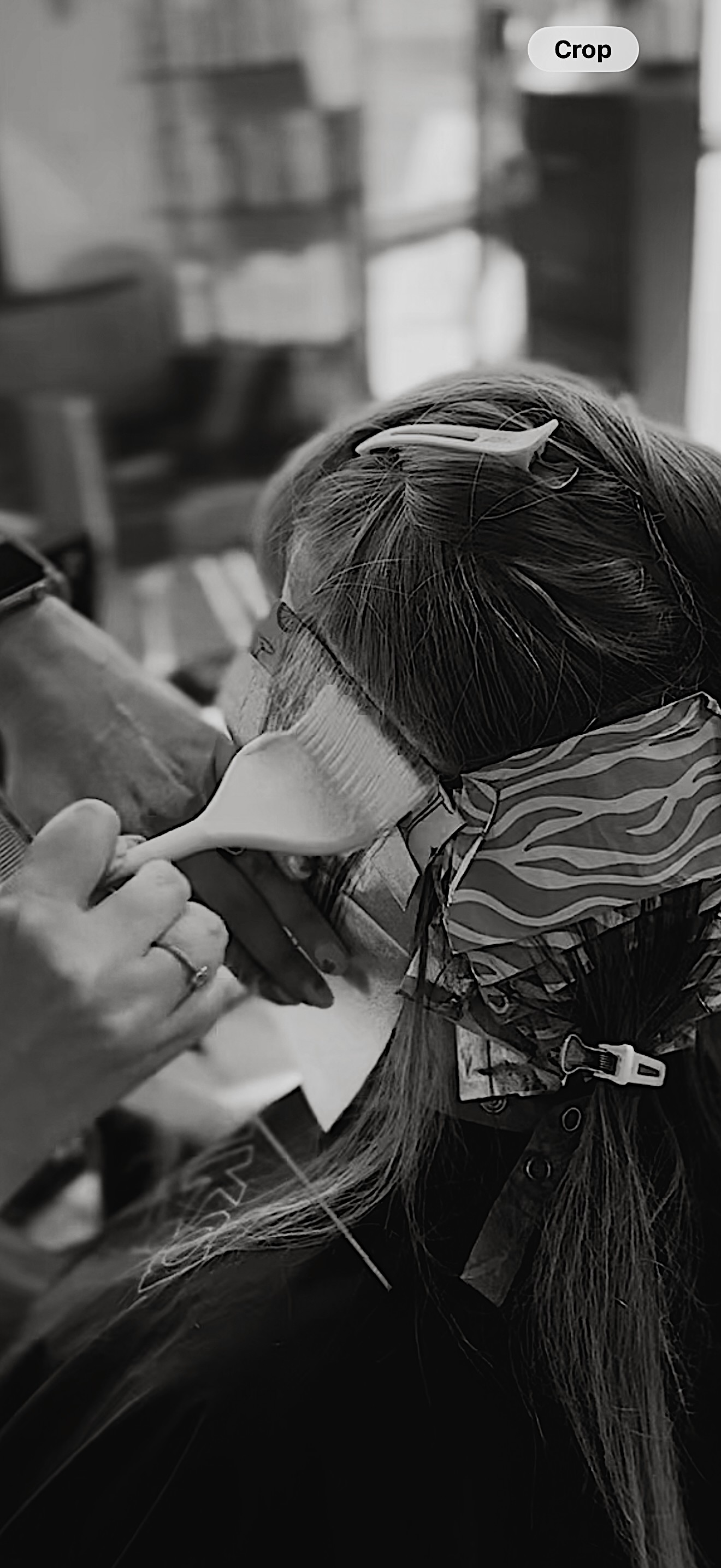 Person receiving a medical injection in a clinical setting, with a healthcare worker administering the shot.