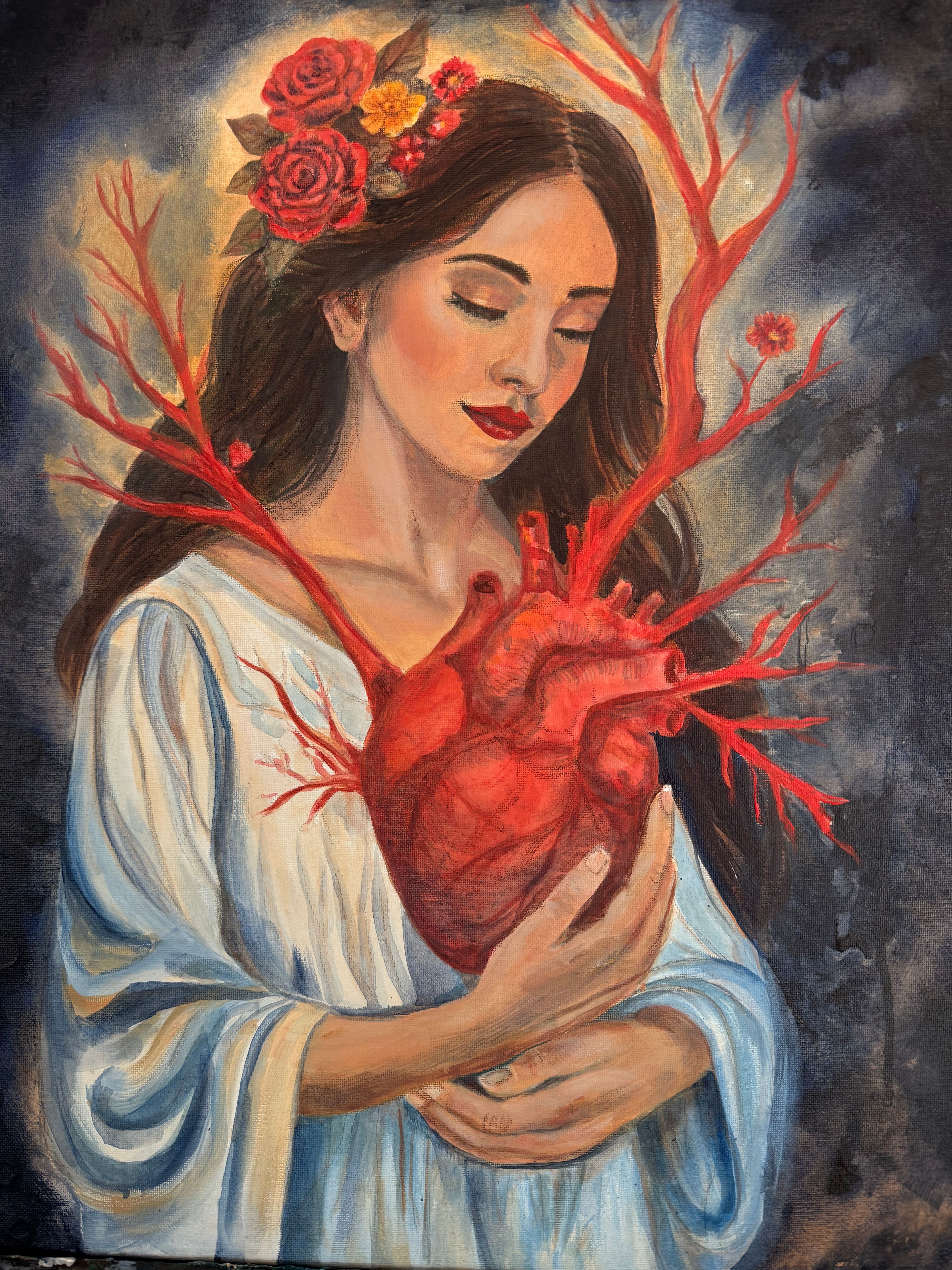 A woman with flowers in her hair holds a large, realistic heart with blood vessels, lying on a white cloth.
